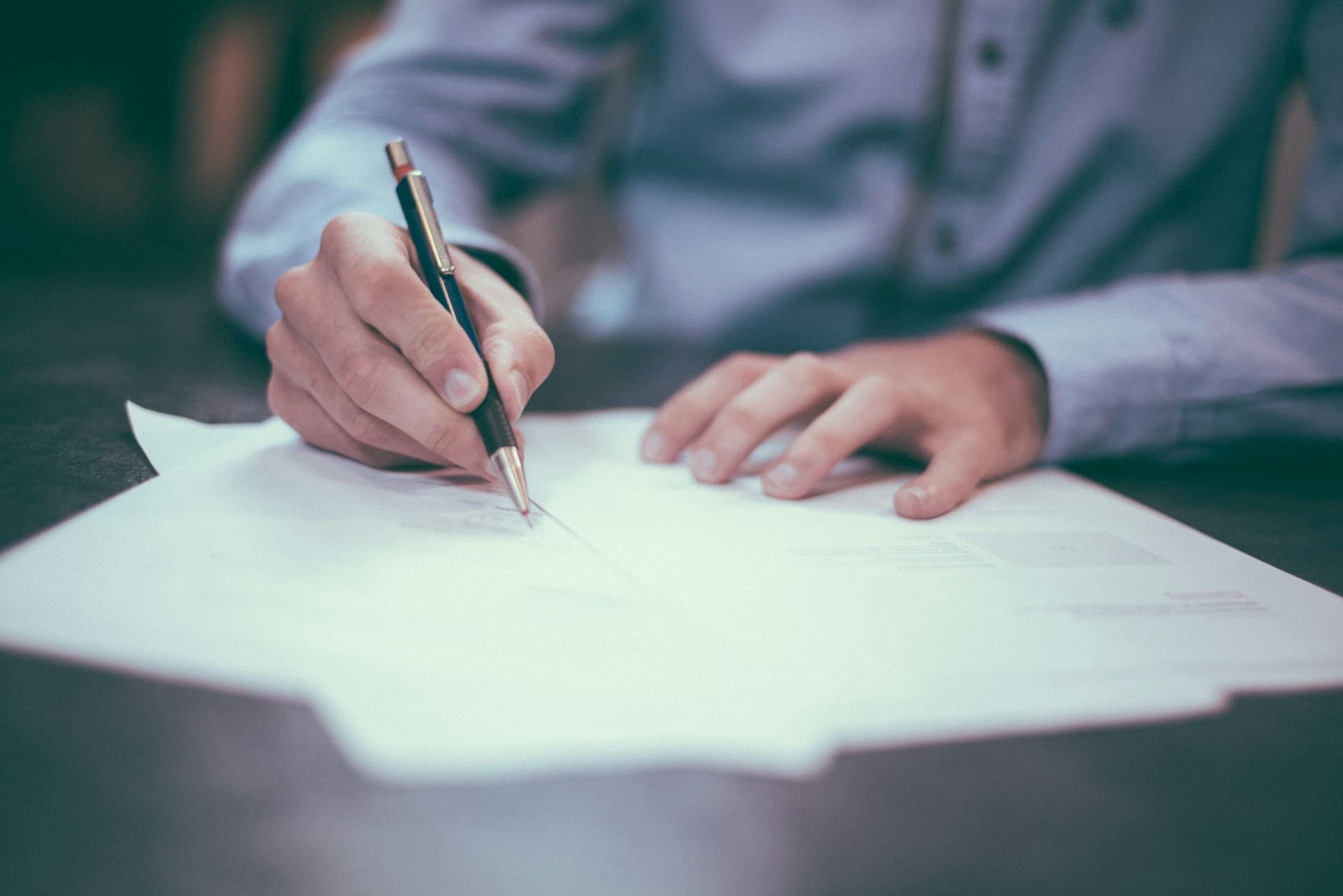 Traveler reviewing documents at a cafe before a trip