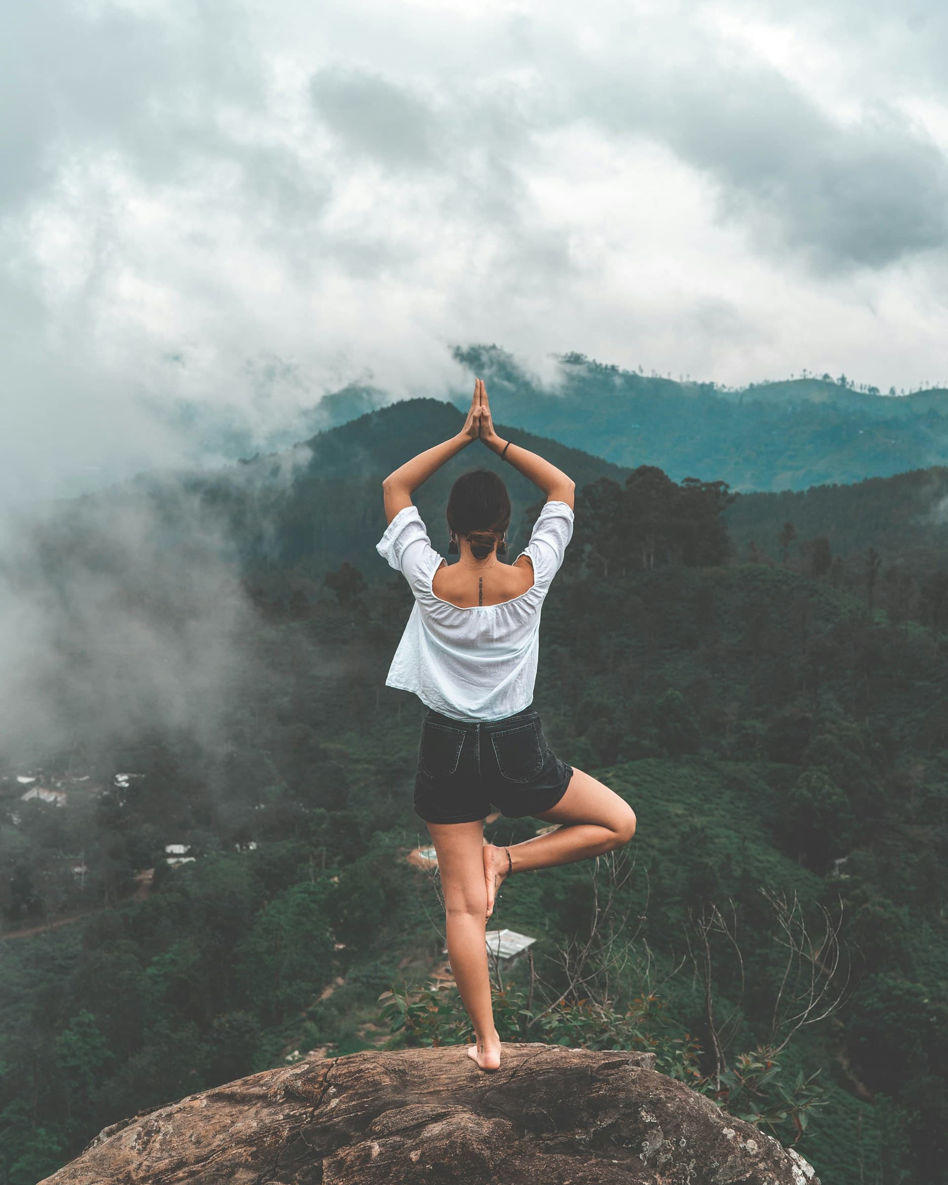 Open-air yoga pavilion overlooking rice terraces at sunrise