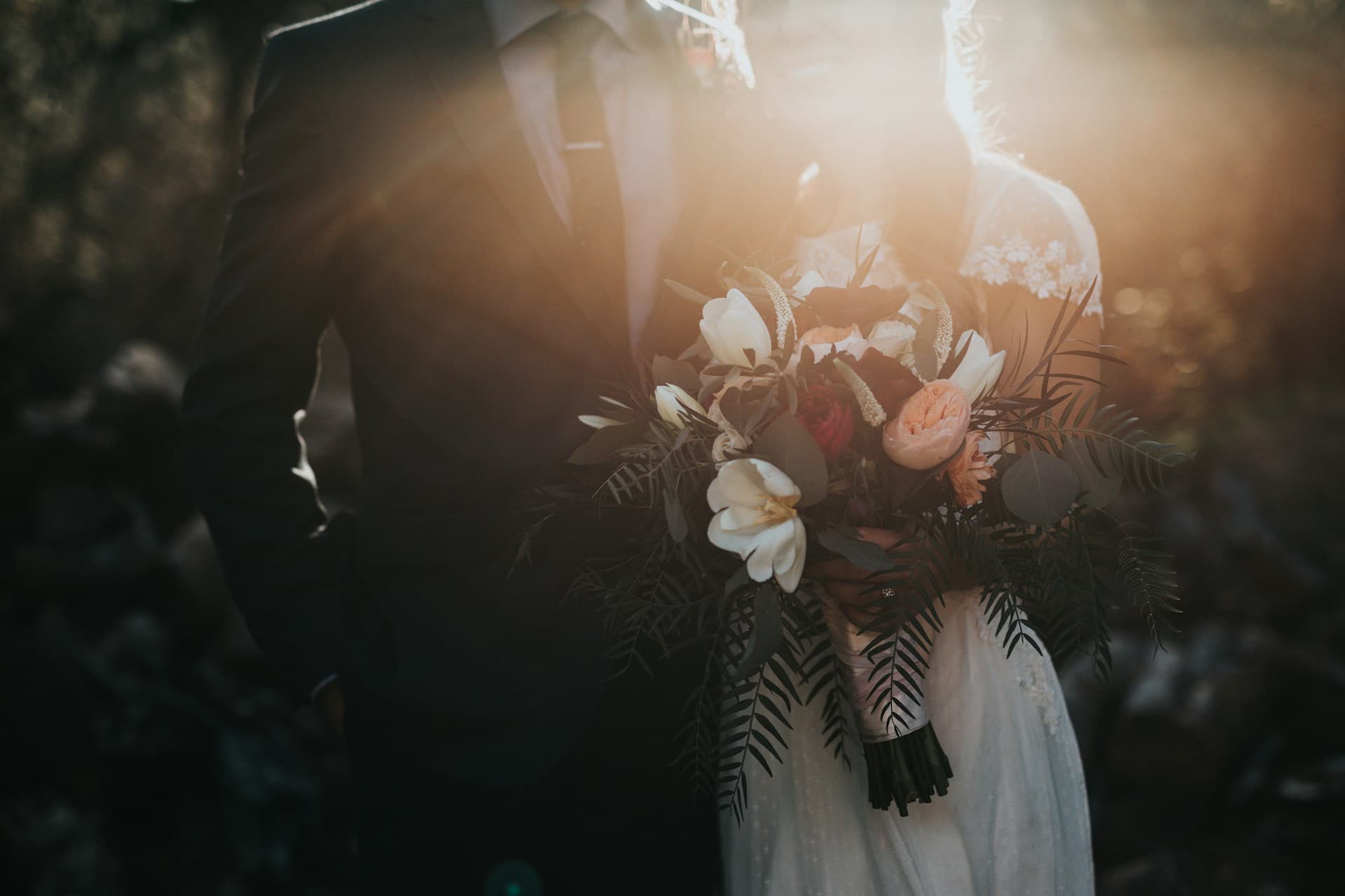 Wedding guests mingling at an outdoor reception in a Mediterranean setting